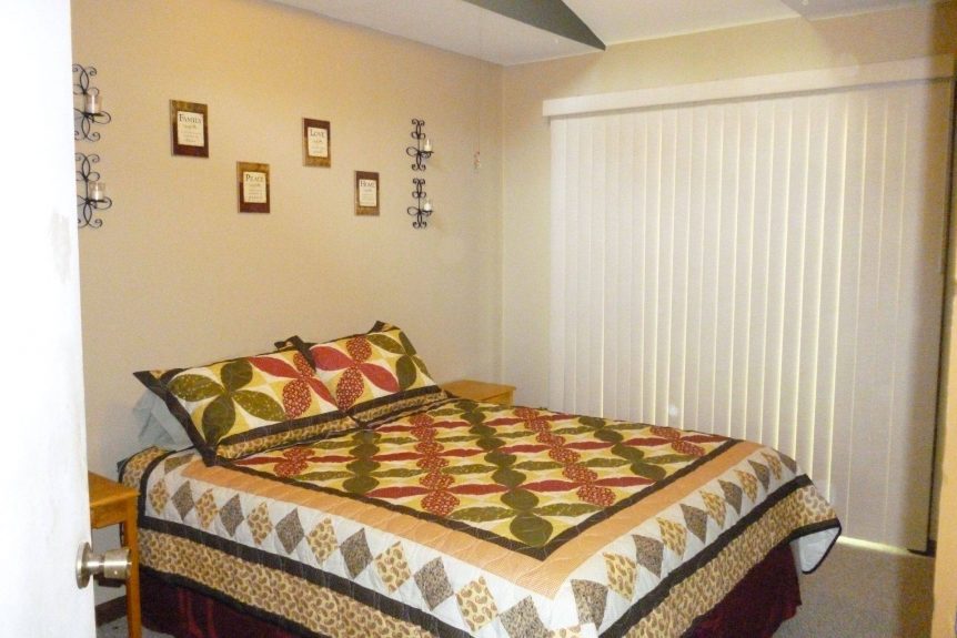 roomy bedroom with queen bed at Forest Glen rental cabin